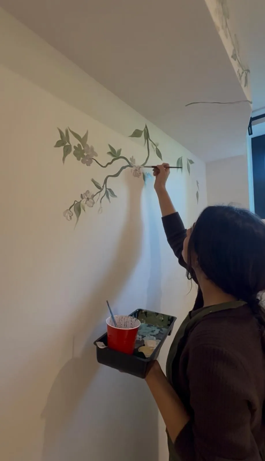 Contemporary hand-painted wall mural by artist Shruti Bhatt
